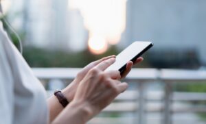 Woman using smartphone, During leisure time. The concept of using the phone is essential in everyday life.